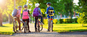 Children Cycling to School